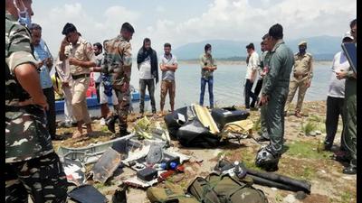 Army personnel inspect the site after an army helicopter crashed near Ranjit Sagar Dam Lake in Kathua district on August 3. (File photo)