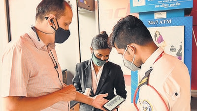 Mall security check vaccination certificates of the customers before they are allowed to enter Central Mall at Erandwane on Monday. Malls in Pune saw low footfalls on first day of reopening. (KALPESH NUKTE/HT) Mall security check vaccination certificates of the customers before they are allowed to enter Central Mall at Erandwane on Monday. Malls in Pune saw low footfalls on first day of reopening. (KALPESH NUKTE/HT)
