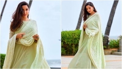 Nora Fatehi looked fresh as a daisy in this pastel green simple Anarkali. She teamed it with a green and white embroidered dupatta and accessorised her look with big stone rings. (Instagram/@norafatehi)