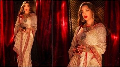 Nora Fatehi is the epitome of royalty in this sequined saree by designer Anjul Bhandari. (Instagram/@norafatehi)