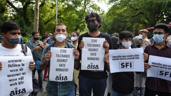Demonstrators hold placards during a protest against communal hatred at Jantar Mantar, in New Delhi on August 10, 2020. (Sanchit Khanna/HT Photo)