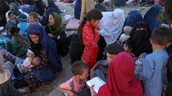 Internally displaced Afghans who fled their home in north provinces due to fighting between the Taliban and Afghan security personnel, are seen at a public park in Kabul, on Monday.(AP Photo)