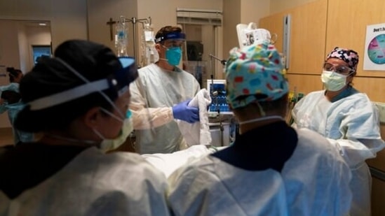(Representational) - In this Nov. 19, 2020, file photo, medical personnel prepare to prone a COVID-19 patient at Providence Holy Cross Medical Center in the Mission Hills section of Los Angeles. (AP)
