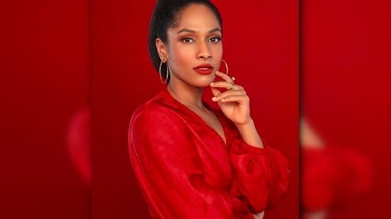 In another, she posed in a bright red wrap top. With blushed cheek and lips, Masaba accessorised her look with hoop earrings.(Instagram/@masabagupta)