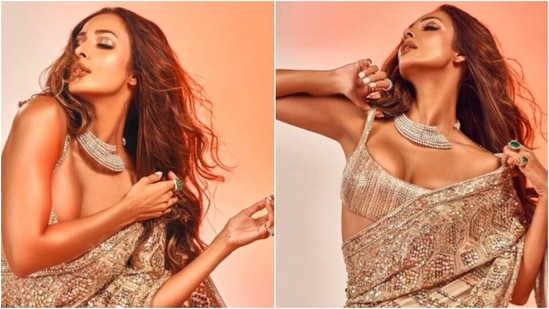 Designer Manish Malhotra took to his Instagram handle to share these stunning pictures of Malaika and captioned it, "Supremely Glamourised and Gorgeousssssss in the Metallic Saree."(Instagram/@manishmalhotraofficial)