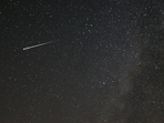 A meteor dashes above Tvrtkovac mountain during the Perseid meteor shower seen from Zenica, Bosnia and Herzegovina.(Reuters Photo)