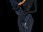 Kim Kardashian wearing a full head to toe covered ensemble by Balenciaga, with only her pony wig snaking behind her as she holds Chicago at the Donda event.(Instagram) Kim Kardashian wearing a full head to toe covered ensemble by Balenciaga, with only her pony wig snaking behind her as she holds Chicago at the Donda event.(Instagram)
