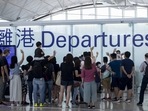 Family and friends see off travellers in the departures hall at Hong Kong International Airport in Hong Kong, China. Family and friends see off travellers in the departures hall at Hong Kong International Airport in Hong Kong, China.