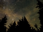 This NASA handout photo shows a 30 second exposure,as a meteor streaks across the sky during the annual Perseid meteor shower on August 11, 2021, in Spruce Knob, West Virginia.(AFP)
