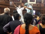Congress MPs Partap Singh Bajwa and Ripun Bora protest inside the Rajya Sabha during short debate on farmers' issue, on Tuesday.(PTI Photo) Congress MPs Partap Singh Bajwa and Ripun Bora protest inside the Rajya Sabha during short debate on farmers' issue, on Tuesday.(PTI Photo)