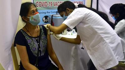 A BMC health worker administers Covid-19 vaccine to a beneficiary at a vaccination centre in Colaba, Mumbai, on August 7. (File photo) A BMC health worker administers Covid-19 vaccine to a beneficiary at a vaccination centre in Colaba, Mumbai, on August 7. (File photo)