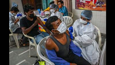 Residents get inoculated with a dose of Covaxin vaccine against the Covid-19 coronavirus at a temporary vaccination centre set up in a school in Mumbai. (AFP) Residents get inoculated with a dose of Covaxin vaccine against the Covid-19 coronavirus at a temporary vaccination centre set up in a school in Mumbai. (AFP)