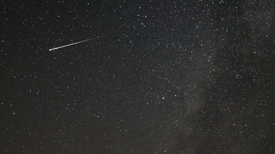 A meteor dashes above Tvrtkovac mountain during the Perseid meteor shower seen from Zenica, Bosnia and Herzegovina. (Reuters Photo)