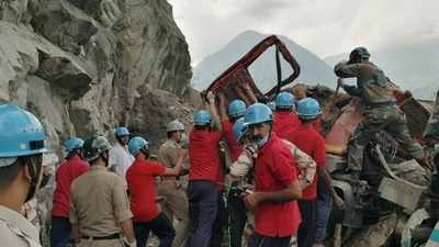 Indo-Tibetan Border Police (ITBP) personnel remove a damaged truck during a rescue operation at the site of a landslide in Kinnaur district in the northern state of Himachal Pradesh, (via Reuters)