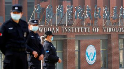 In this file photo, security personnel keep watch outside the Wuhan Institute of Virology in, Hubei province, China. (REUTERS) In this file photo, security personnel keep watch outside the Wuhan Institute of Virology in, Hubei province, China. (REUTERS)