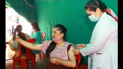 A woman taking a selfie while getting vaccinated against Covid-19 at a health camp in Kullu on Wednesday. (Aqil Khan/HT) A woman taking a selfie while getting vaccinated against Covid-19 at a health camp in Kullu on Wednesday. (Aqil Khan/HT)