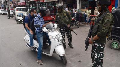 Security personnel check the ID of a vehicle in Srinagar. (Representational image/ANI) Security personnel check the ID of a vehicle in Srinagar. (Representational image/ANI)