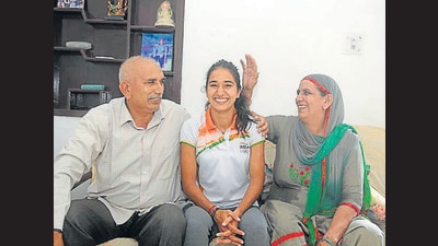 Indian hockey player Monika Malik with her parents at her residence in Sector 44, Chandigarh, on Wednesday. (Ravi Kumar/HT) Indian hockey player Monika Malik with her parents at her residence in Sector 44, Chandigarh, on Wednesday. (Ravi Kumar/HT)