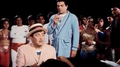 Raj Kapoor and Dharmendra in a still from Mera Naam Joker. Raj Kapoor and Dharmendra in a still from Mera Naam Joker.