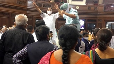 Congress MPs Partap Singh Bajwa and Ripun Bora protest inside the Rajya Sabha during short debate on farmers' issue, on Tuesday. (PTI Photo) Congress MPs Partap Singh Bajwa and Ripun Bora protest inside the Rajya Sabha during short debate on farmers' issue, on Tuesday. (PTI Photo)