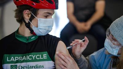 A cyclist receives a dose of the Pfizer-BioNTech Covid-19 vaccine at the Gilles Villeneuve racetrack in Montreal, Quebec, Canada. (Bloomberg/File) A cyclist receives a dose of the Pfizer-BioNTech Covid-19 vaccine at the Gilles Villeneuve racetrack in Montreal, Quebec, Canada. (Bloomberg/File)