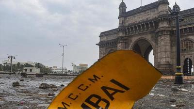 A signboard blown away by Cyclone Tauktae near Gateway of India in Mumbai on May 18, 2021. (PTI) A signboard blown away by Cyclone Tauktae near Gateway of India in Mumbai on May 18, 2021. (PTI)