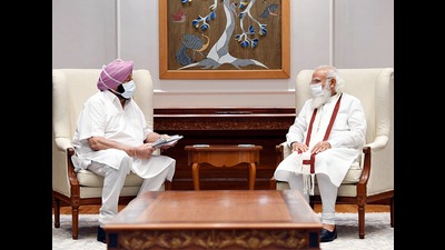 Punjab chief minister Capt Amrinder Singh with PM Narendra Modi in New Delhi on Wednesday. (ANI)