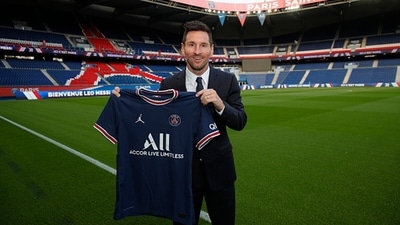 Lionel Messi poses with the Paris Saint-Germain jersey after signing a 2 year contract at Parc des Princes. (Getty Images) Lionel Messi poses with the Paris Saint-Germain jersey after signing a 2 year contract at Parc des Princes. (Getty Images)