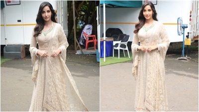 Nora Fatehi chose a bespoke anarkali, embroidered with gold and white thread work and silver sequins. The long sleeves of the suit were also embellished with sequinned tassels on the cuffs. (Varinder Chawla) Nora Fatehi chose a bespoke anarkali, embroidered with gold and white thread work and silver sequins. The long sleeves of the suit were also embellished with sequinned tassels on the cuffs. (Varinder Chawla)