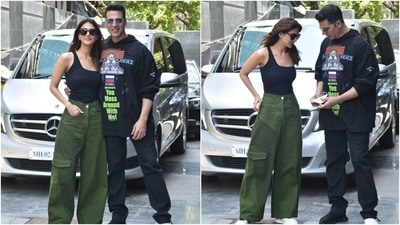Akshay chose an oversized sweatshirt for the outing. It featured quirky prints and slogans like 'Don't you mess around with me!" written on it in neon green colour. He teamed the hoodie with black trousers. (Varinder Chawla) Akshay chose an oversized sweatshirt for the outing. It featured quirky prints and slogans like 'Don't you mess around with me!" written on it in neon green colour. He teamed the hoodie with black trousers. (Varinder Chawla)