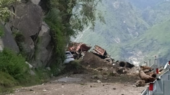 The vehicles buried under the debris at Negulsari in the Kinnaur district of Himachal Pradesh on Wednesday,(HT photo)