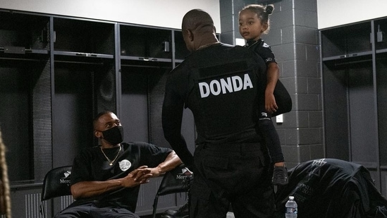 Kanye West with daughter Chicago, all seen in black, matching outfits. (Instagram)