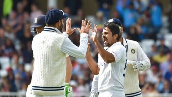 India's Shardul Thakur, right, celebrates with teammates(AP)