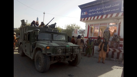 Taliban fighters stand guard at a checkpoint in Kunduz city, northern Afghanistan, August. 9, 2021. The militants have ramped up their push across much of Afghanistan in recent weeks, turning their guns on provincial capitals after taking district after district and large swaths of land in the mostly rural countryside (AP)