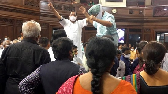 Congress MPs Partap Singh Bajwa and Ripun Bora protest inside the Rajya Sabha during short debate on farmers' issue, on Tuesday.(PTI Photo) Congress MPs Partap Singh Bajwa and Ripun Bora protest inside the Rajya Sabha during short debate on farmers' issue, on Tuesday.(PTI Photo)