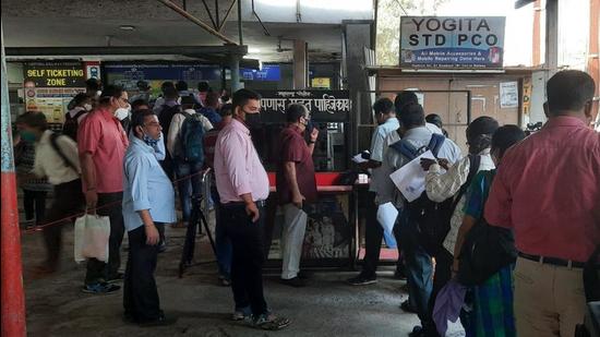 Commuters wait in queue at Dombivili railway station for railway pass on the first day of verification on Wednesday, August 11. (Sourced)