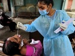 So far, 6,992 Covid-19 cases have been reported in Dharavi. In picture - A BMC health worker collects swab samples for Covid-19 test.(HT Photo) So far, 6,992 Covid-19 cases have been reported in Dharavi. In picture - A BMC health worker collects swab samples for Covid-19 test.(HT Photo)