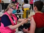 Students receive their first dose of the Pfizer Covid-19 vaccine in Sydney.(AFP) Students receive their first dose of the Pfizer Covid-19 vaccine in Sydney.(AFP)