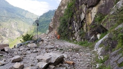 Members of the National Disaster Response Force (NDRF) search for survivors during a rescue operation at the site of a landslide in Kinnaur, Himachal Pradesh. (REUTERS)