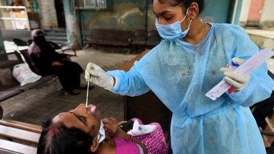 So far, 6,992 Covid-19 cases have been reported in Dharavi. In picture - A BMC health worker collects swab samples for Covid-19 test. (HT Photo) So far, 6,992 Covid-19 cases have been reported in Dharavi. In picture - A BMC health worker collects swab samples for Covid-19 test. (HT Photo)