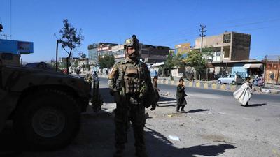An Afghan security force personnel stands guard along the roadside in Herat on August 12. (AFP)