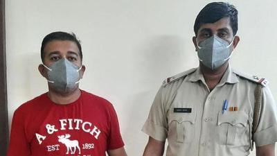 The suspect (in red t-shirt) was remanded to two-day police custody on Thursday.