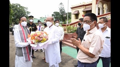 Manipur chief minister N Biren Singh presents a bouquet to new governor Ganga Prasad at Raj Bhavan in Imphal on Thursday, August 12. (DIPR, Manipur)