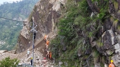 National Disaster Response Force (NDRF) personnel during rescue operations at the site of a landslide at the Reckong Peo-Shimla Highway in Kinnaur District in Himachal Pradesh. (AFP) National Disaster Response Force (NDRF) personnel during rescue operations at the site of a landslide at the Reckong Peo-Shimla Highway in Kinnaur District in Himachal Pradesh. (AFP)