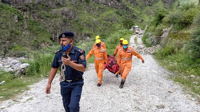 NDRF team carry a body recovered during a rescue operation after a landslide in Kinnaur, Himachal Pradesh. (PTI) NDRF team carry a body recovered during a rescue operation after a landslide in Kinnaur, Himachal Pradesh. (PTI)