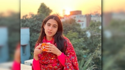 The joy one gets while watching the sunset, sipping a cup of coffee or tea cannot be described in words. This picture of Sara Ali Khan with no makeup and a red shawl proves that she is like any other 90s girl who finds joy in the little things in life. (Instagram/@saraalikhan95) The joy one gets while watching the sunset, sipping a cup of coffee or tea cannot be described in words. This picture of Sara Ali Khan with no makeup and a red shawl proves that she is like any other 90s girl who finds joy in the little things in life. (Instagram/@saraalikhan95)