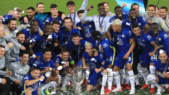 Chelsea players pose with the trophy after winning the UEFA Super Cup soccer match against Villarreal at Windsor Park in Belfast, Northern Ireland, Wednesday, Aug. 11, 2021. (AP Photo/Peter Morrison)(AP)