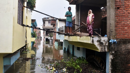 Houses seen partially submerged due to the rise in the water level of the Ganga river, at Salori area, in Prayagraj, Uttar Pradesh. (ANI)