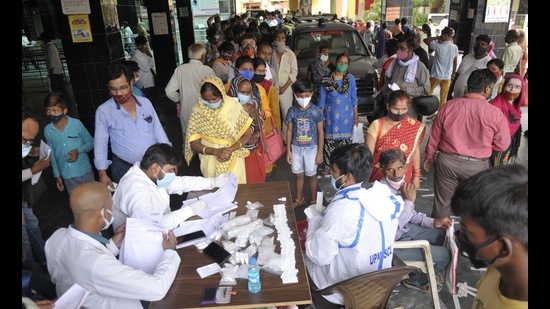 Health worker collecting samples for Covid test in Lucknow. (Deepak Gupta/HT Photo)