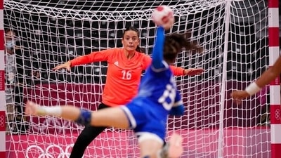 France's goalkeeper Cleopatre Darleux, left, makes a save as Anna Vyakhireva, of the Russian Olympic Committee, misses a chance during the women's gold medal handball match between the Russian Olympic Committee and France at the 2020 Summer Olympics. (AP)